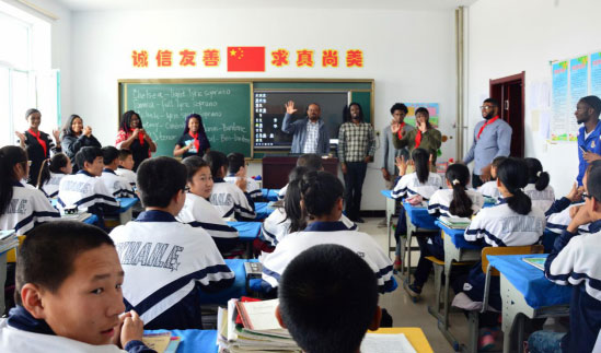 Foreign students volunteering teaching for village students