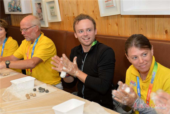 Clipper Race Qingdao crew members make glutinous rice balls