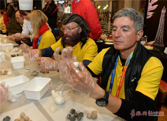 Clipper Race Qingdao crew members make glutinous rice balls