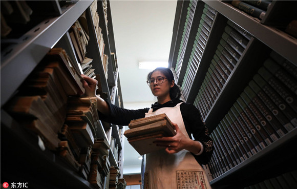 Young but skillful hands restore 300 old books