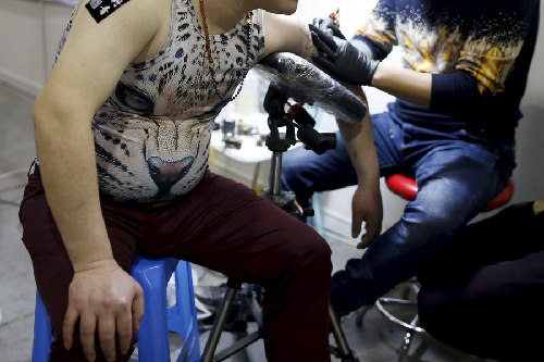 Tattoo fans, artists gather at Shanghai international art festival