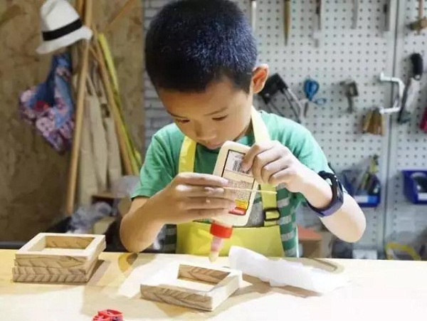 Families enjoy wood workshop in mountain forest