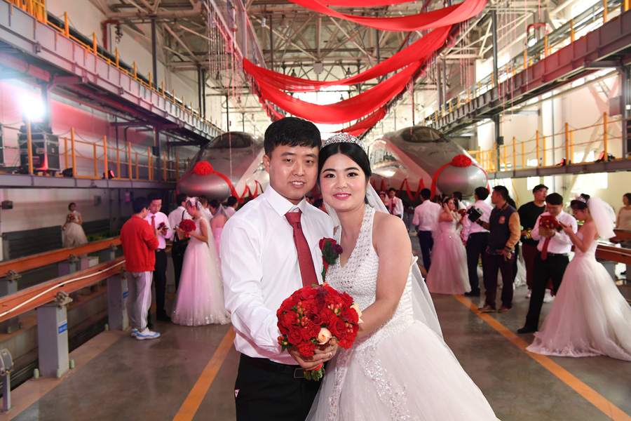 Couples start new journey at bullet train maintenance center