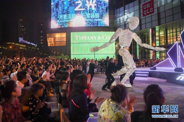 Giant figure dances for Shenyang shoppers