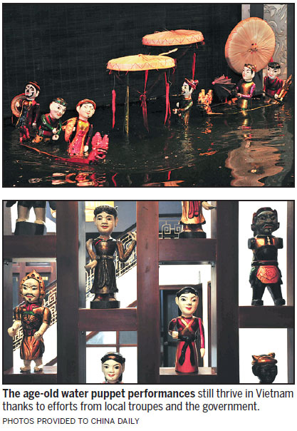 Tourists enjoy water puppet shows in Hanoi