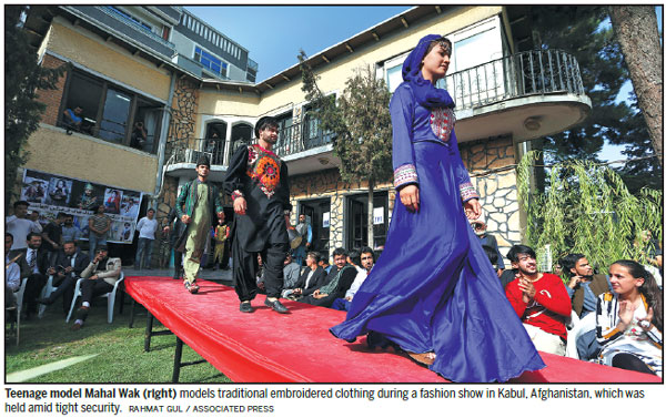 Models promote clothing, culture in show of unity on Kabul catwalk