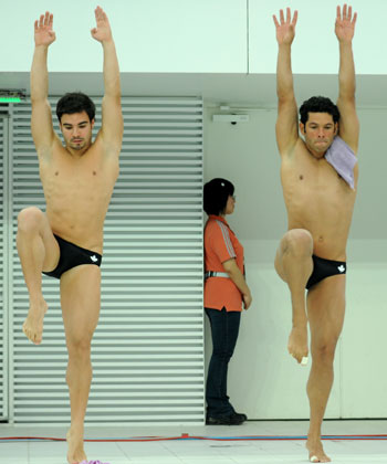 Canadians Alexandre Despatie (R) and Arturo Miranda get ready to compete at the men's 3m synchronized springboard preliminaries during the 16th FINA Diving World Cup tournament held at the National Aquatics Center in Beijing Feb, 19, 2008. Despatie and his partner took the third place in the final, with Wang and Qin of China won the gold medal. [Xinhua]