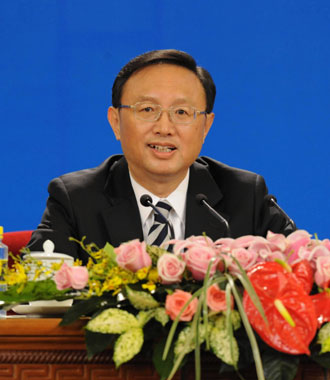 Chinese Foreign Minister Yang Jiechi listens to questions from press in a press conference on the sideline of the ongoing parliament session. [Xinhua]