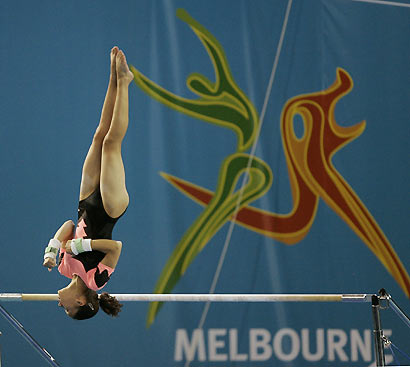 A gymnast from Namibia practices on the uneven bars during a training session in the Rod Laver Arena in Melbourne, Australia March 14, 2006. Athletes are preparing for the Commonwealth Games which begin March 15. [Reuters]