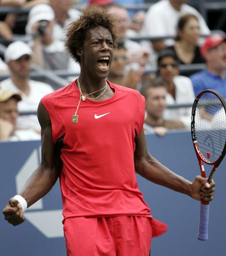 France's Gael Monfils celebrates winning a point during his match against Michael Russell of the United States at the U.S. Open tennis tournament in New York August 30, 2006. 