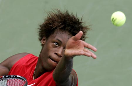 France's Gael Monfils serves to Michael Russell of the United States during their match at the U.S. Open tennis tournament in New York, August 30, 2006.