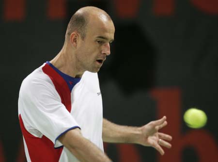 Ivan Ljubicic of Croatia returns the ball to Denis Gremelmayr of Germany during the Qatar Open tennis tournament in Doha January 2, 2007.