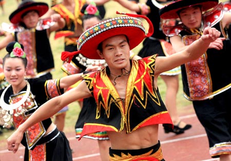 Ethnic Miao performers dance during the opening ceremony of Kaili Original Ethnic Culture & Arts Festival in Kaili, Qiandongnan Miao-Dong Autonomous Prefecture, Southwest China's Guizhou Province, July 23, 2007. There are 47 nationalities, such as the Miao, Dong, and Buyi, in Qiandongnan, making it the prefecture with the largest number and highest proportion of the ethnic-minority population in China.[newsphoto]
