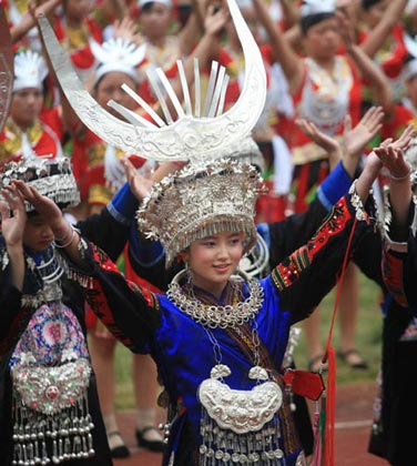 Ethnic Miao performers dance during the opening ceremony of Kaili Original Ethnic Culture & Arts Festival in Kaili, Qiandongnan Miao-Dong Autonomous Prefecture, Southwest China's Guizhou Province, July 23, 2007. There are 47 nationalities, such as the Miao, Dong, and Buyi, in Qiandongnan, making it the prefecture with the largest number and highest proportion of the ethnic-minority population in China.[newsphoto]