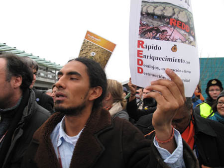 Protesters march outside Copenhagen summit venue