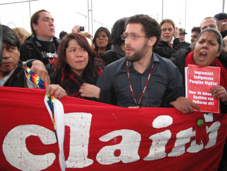 Protesters march outside Copenhagen summit venue