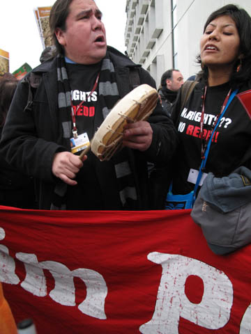 Protesters march outside Copenhagen summit venue