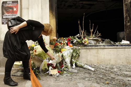 Greeks pray for good to three killed in protest