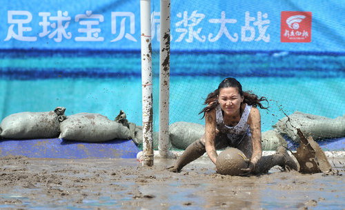 Soccer babes fight in mud to herald World Cup