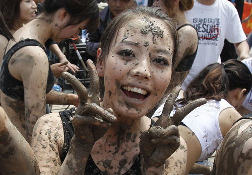 Soccer babes fight in mud to herald World Cup
