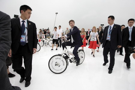 Denish crown prince rides a bike on Expo