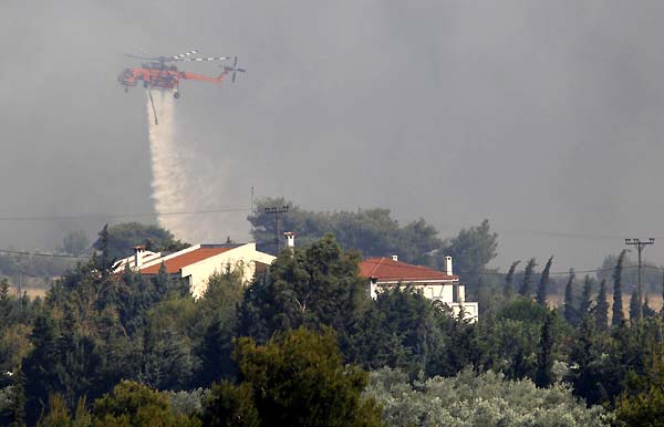 Wildfires rage in Athens suburbs, causing property damage