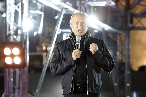 Putin rides with 'Night Wolves' at bike festival