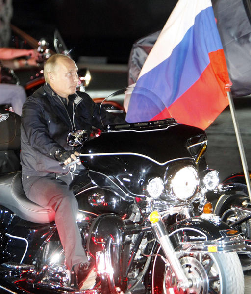 Putin rides with 'Night Wolves' at bike festival