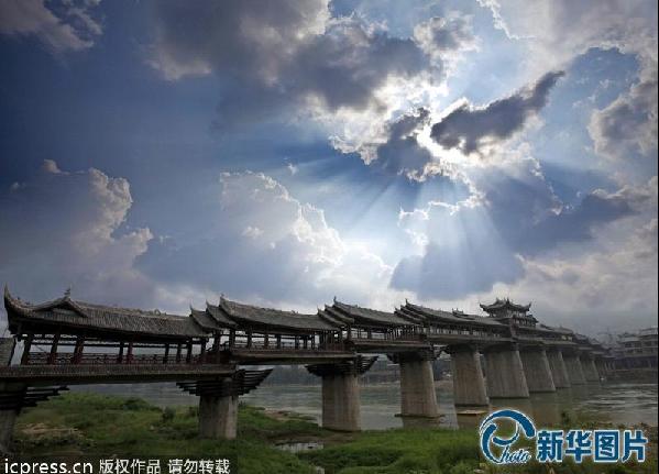 Fire destroys covered bridge in SW China