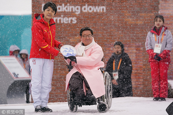 Chinese Paralympic athletes welcomed at Olympic Village in Pyeongchang
