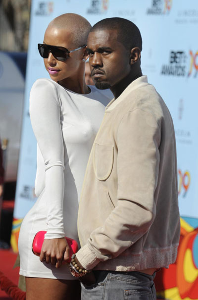 Rapper Kanye West poses with Amber Rose while at the BET Awards '09
