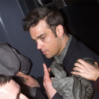 Robbie Williams shines for stars