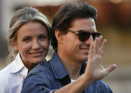 Tom Cruise holds Suri during a break in filming in Seville