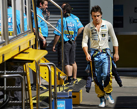 Renault's Formula One driver Fernando Alonso of Spain walks after finishing a practice session for the British Grand Prix at the Silverstone race track in Northamptonshire, central England, June 10, 2006.