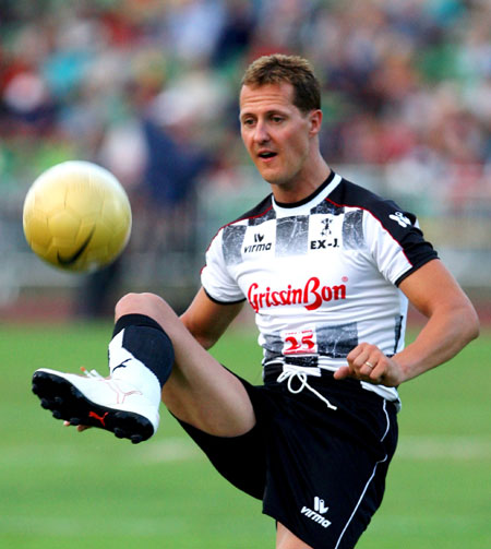 Schumacher plays soccer during a charity game