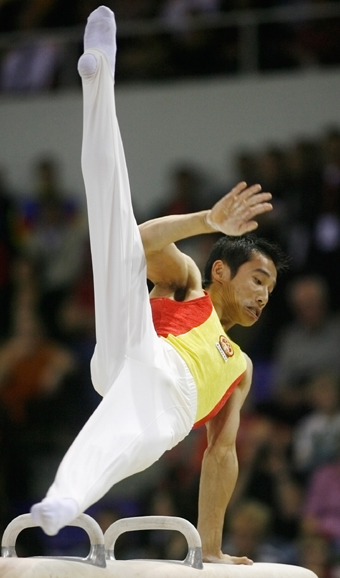 Chinese add three golds to double haul at gymn