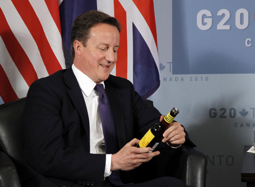 Obama, Cameron pay off World Cup bet with beer