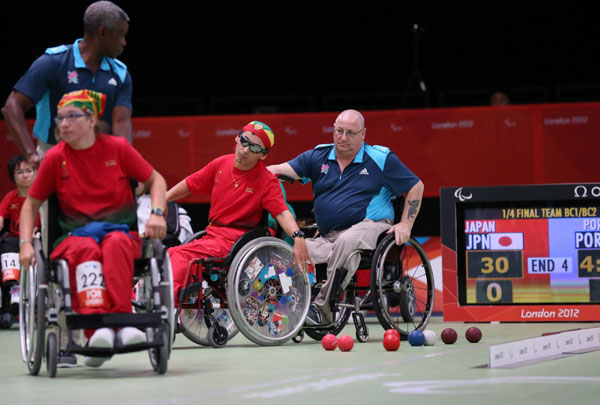 Many referees, technical officials, award ceremony presenters and volunteers, who have physical disability, work for the athletes at the London Paralympics Games. Disabled helpers serve London Paralympics