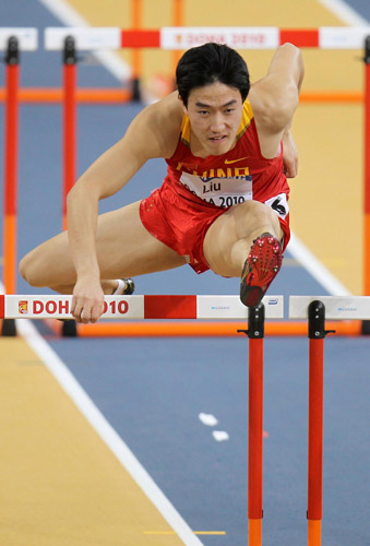 Liu Xiang competes in hurdles heats in Doha