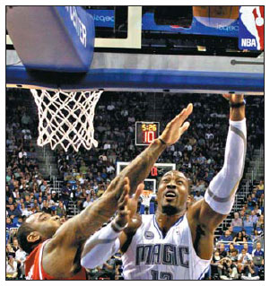 Magic holds off Hawks' late charge
