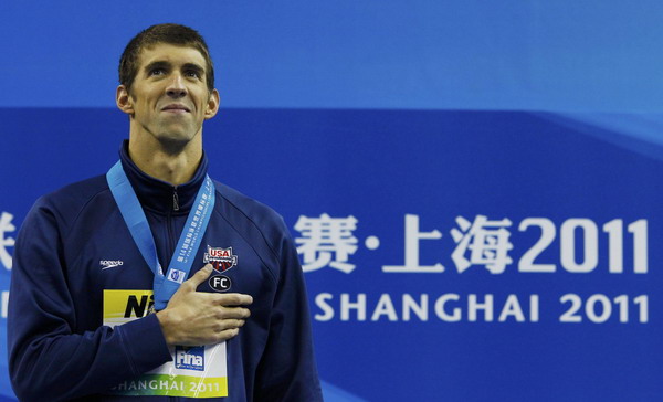 Phelps takes 3rd gold at swim worlds in 100 fly