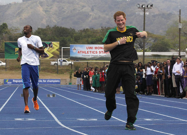 Prince Harry runs with Usain Bolt in Jamaica