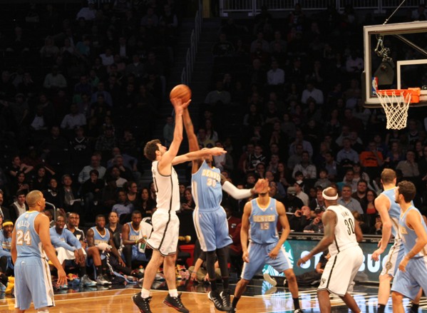 Nets knocked down by Nuggets, home boos