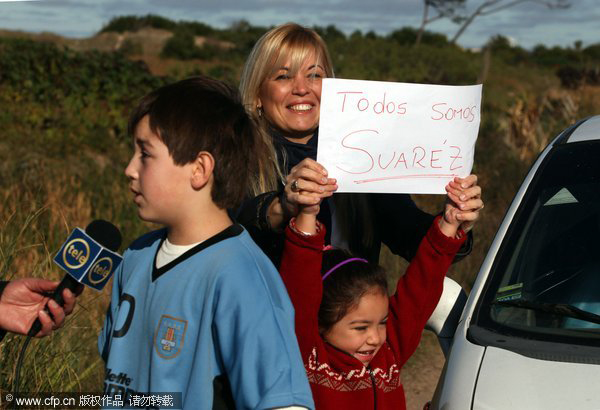 Luis Suarez receives a hero's welcome at home