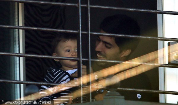 Luis Suarez receives a hero's welcome at home