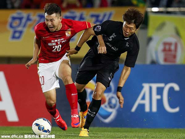 Late penalty stuns Guangzhou Evergrande