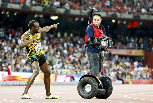 Bolt 'somersaults' after cameraman takes him down