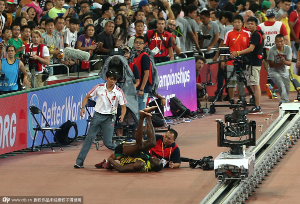 Bolt 'somersaults' after cameraman takes him down