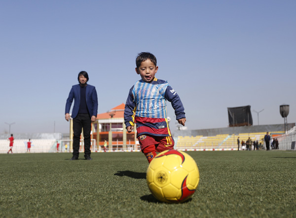 Afghan boy who wore plastic bag 'Messi' shirt gets signed jersey from soccer star