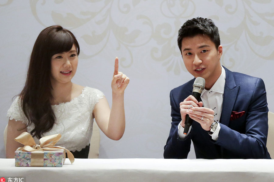 Newly-married table tennis lovebirds show their love